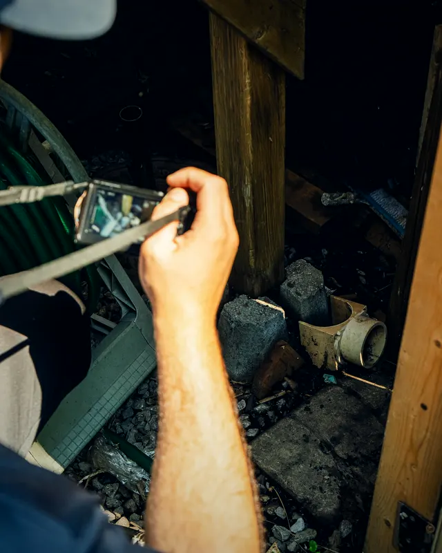 Flashlight inspection of a deck’s structure.